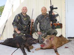 Matt and Mike with their two River boars