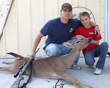 Joe and his daughter with their doe